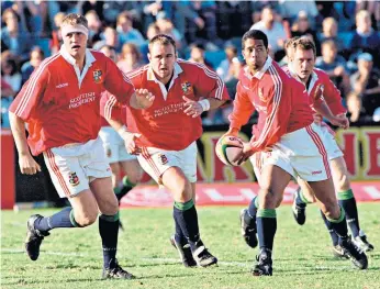  ??  ?? Memories: Doddie Weir (left) has set his sights on the 2021 Lions tour of South Africa, where he represente­d Britain and Ireland in 1997