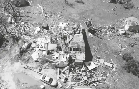  ?? JAIME GREEN/AP ?? A HOME IS DESTROYED FROM A POSSIBLE TORNADO the next before near Andover, Kan., on Saturday A suspected tornado that barreled through parts of Kansas has damaged multiple buildings, injured several people and left more than 6,500 people without power.