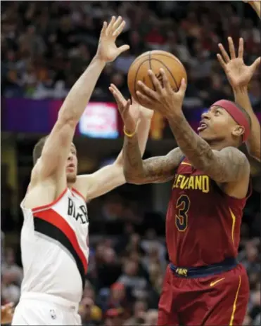  ?? TONY DEJAK — THE ASSOCIATED PRESS ?? Cleveland’s Isaiah Thomas (3) drives to the basket against Portland’s Pat Connaughto­n (5) second half on Tuesday in Cleveland. The Cavaliers won, 127-110. in the