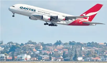  ?? PETER PARKS AFP/GETTY IMAGES ?? Qantas challenged Boeing and Airbus to design planes capable of a direct flight from Sydney to London or New York.