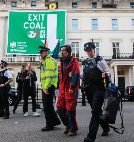  ?? PHOTO: GETTY ?? Protest: An activist is arrested at the German Embassy in London yesterday in a protest against coal.