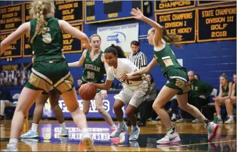  ?? PHOTO BY REBA SALDANHA — BOSTON HERALD ?? St. Mary’s Niya Morgen makes her way through Bishop Feehan’s, from left, Madelyn Steel, Samantha Reale and Lily Singer during a regular-season game. St. Mary’s is the top girls seed in Division 3.