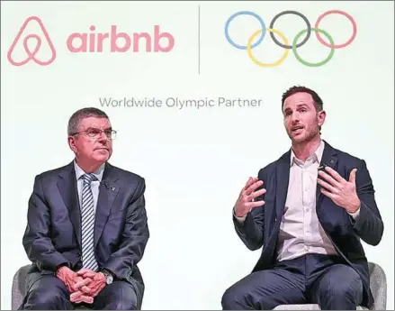  ?? AFP ?? Internatio­nal Olympic Committee (IOC) president Thomas Bach (left) and Airbnb co-founder Joe Gebbia speak at an event in London to announce Airbnb as a leading partner of the Olympics on Monday.