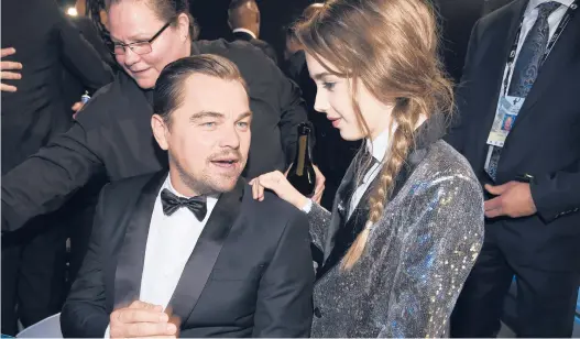  ?? CHRIS PIZZELLO/AP ?? “Once Upon a Time ... in Hollywood”stars Leonardo DiCaprio and Julia Butters at the 26th annual Screen Actors Guild Awards in January 2020.