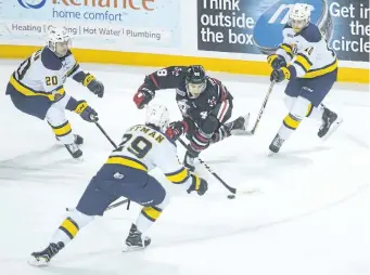  ?? JULIE JOCSAK/ STANDARD STAFF ?? Sam Miletic of the Niagara IceDogs tries to get the puck past Chd Yetman of the Erie Otters in OHL action at the Meridian Centre in downtown St. Catharines.