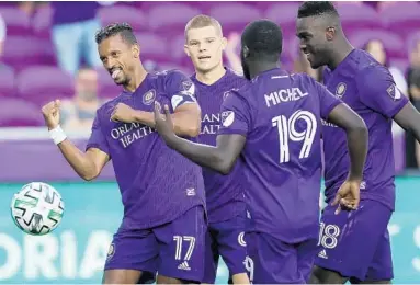  ?? STEPHEN M. DOWELL/ORLANDO SENTINEL ?? Orlando City’s Nani (17), Chris Mueller, Benji Michel (19) and Daryl Dike celebrate during a preseason match at Exploria Stadium. The Lions and the rest of MLS will resume play during a tournament in Orlando after the league and players agreed to a new CBA.