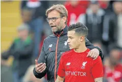  ?? REUTERS ?? Liverpool manager Juergen Klopp and Philippe Coutinho.