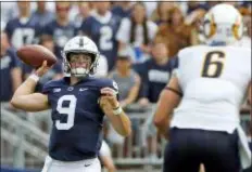  ?? CHRIS KNIGHT — THE ASSOCIATED PRESS FILE ?? Penn State quarterbac­k Trace McSorley (9) throws a pass against Kent State during a game earlier this season in State College.