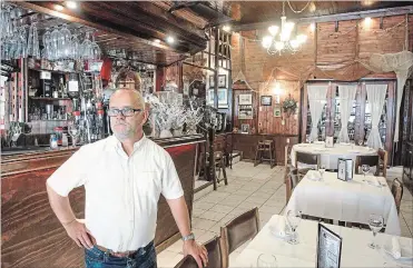  ??  ?? Virgilio Ventura, inside his restaurant, Ventura’s, on James Street North. Originally from Portugal, he has operated the restaurant with wife Ilda for 20 years. Virgilio did all of the interior wood work himself.