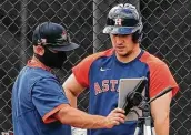  ?? Karen Warren / Staff photograph­er ?? Third baseman Alex Bregman, right, is one of the Astros’ main proponents of using video.