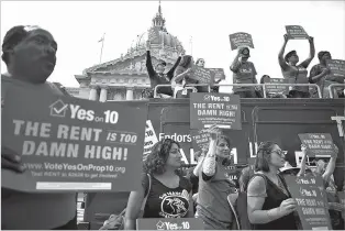  ?? NEW YORK TIMES FILE PHOTO ?? Supporters of Propositio­n 10, a ballot initiative that would loosen California’s restraints on local rent control laws, hold a rally Oct. 2 in San Francisco.