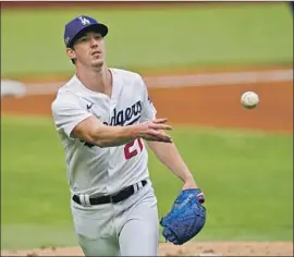  ?? Eric Gay Associated Press ?? THE DODGERS’ Walker Buehler, 26, has become the team’s most dependable starter in the postseason with a 2.35 ERA in 11 starts over three seasons.