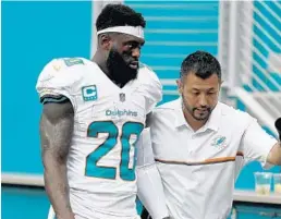  ?? WILFREDO LEE/AP ?? Free safety Reshad Jones, here leaving a game last year, has been cleared to participat­e in the team’s OTAs.