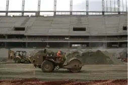  ?? RENATA BRITO/THE ASSOCIATED PRESS ?? As Brazil readies stadiums to host the 2014 World Cup, FIFA has announced the event will dump 2.72 million tonnes of carbon dioxide into the atmosphere.