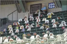  ?? AP photo ?? Milwaukee Brewers’ fans are seen on picture cutouts in the upper deck during a practice session Monday at Miller Park in Milwaukee.