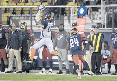  ?? PHELAN M. EBENHACK/ORLANDO SENTINEL PHOTOS ?? front of Express defensive back Charles James II during the half Saturday night.