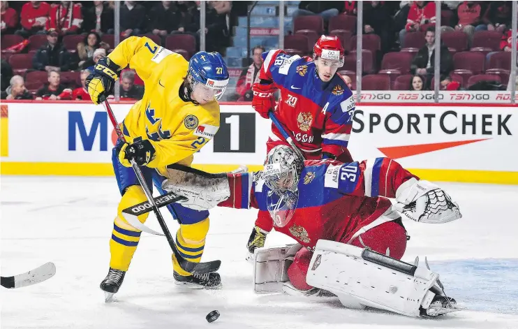  ?? — PHOTOS: GETTY IMAGES FILES ?? Jonathan Dahlen chases the puck during the World Junior Championsh­ips in January. The Canucks acquired Dahlen from Ottawa at the trade deadline.
