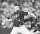  ?? VAUGHN RIDLEY/GETTY IMAGES ?? Ubaldo Jimenez, above, relieved Brian Duensing with one out in the 11th.