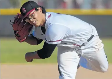  ?? MICHAEL LAUGHLIN/STAFF FILE PHOTO ?? Jesus Luzardo was a star pitcher for Stoneman Douglas High in 2016 when he injured his elbow, and had surgery to repair it.