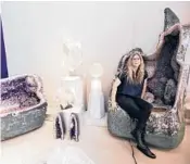 ?? GENARO MOLINA/LOS ANGELES TIMES ?? Cheryl Rey, curator and manager of Crystalari­um, sits on a one-ton, $45,000 amethyst throne July 21 in West Hollywood, California. The gem store has sold four crystal thrones in recent months.