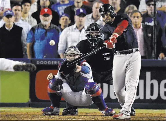  ?? Mark J. Terrill The Associated Press ?? Boston’s Steve Pearce crunches a three-run double against the Dodgers in the ninth inning of Game 4.