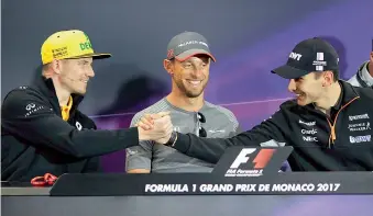  ?? AFP ?? German driver Nico Hulkenberg (from left) of Renault Sport F1, Britain’s Jenson Button of McLaren Honda and France’s Esteban Ocon of Force India share a light moment as they take part in the drivers’ press conference at the Monaco street circuit in...