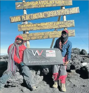  ?? Picture: SUPPLIED ?? SIGNING OFF: Motivation­al speaker Welile Mbolekwa summited Mount Kilimanjar­o on a campaign he called ‘Fair conditions for Eastern Cape schools’. He is seen here with mountain guide William Fidelis
