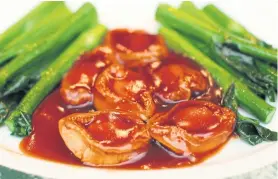  ??  ?? Sautéed whole fresh Australian abalone with oyster sauce and shiitake.