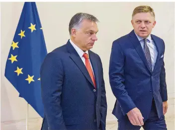  ?? FOTO: GAVLAK/DPA ?? Ih re Klage gegen die Flüc h tlingsau f nah m e wu rde abgewiesen: Ungarns Prem ierm inister Viktor Orbán (l.) u nd der slowakisc h e Regieru ngsc h ef Robert Fic o – h ier bei einem Tref f en in Bratislawa.