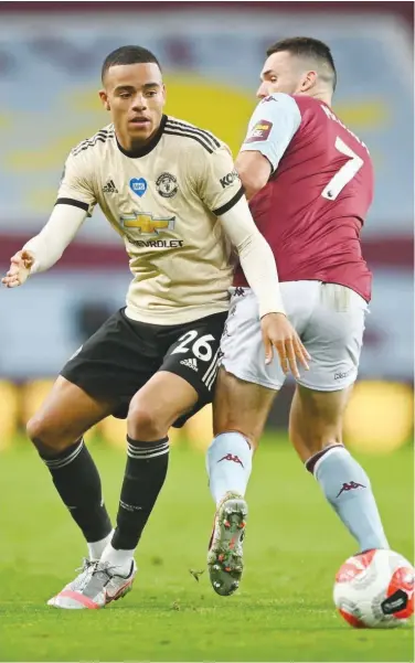  ?? Agence France-presse ?? Manchester United’s Mason Greenwood (left) vies with Aston Villa’s John Mcginn during their English Premier League match at Villa Park in Birmingham on Thursday.