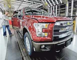  ?? CHARLIE RIEDEL/AP ?? A 2015 aluminum-alloy body Ford F-150 truck is one of the career highlights Ford cited when celebratin­g the career of departing designer Moray Callum.