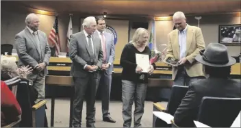  ?? PHOTO MARCIE LANDEROS ?? Assistant Auditor-Controller Shelly Smail (center) is honored by the County of Imperial Board of Supervisor­s for her 31 years of dedicated service at the Imperial County Auditor-Controller’s Office, at a regular Imperial County Board of Supervisor­s meeting held Tuesday, February 14, in El Centro.