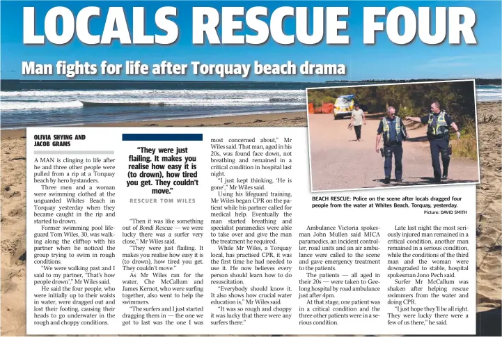  ?? Picture: DAVID SMITH ?? BEACH RESCUE: Police on the scene after locals dragged four people from the water at Whites Beach, Torquay, yesterday.