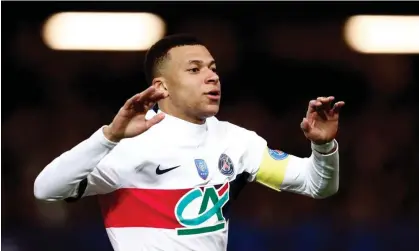  ?? ?? Kylian Mbappé celebrates one of his three goals in Paris Saint-Germain’s 9-0 win over Revel in the French Cup. Photograph: Stéphane Mahé/Reuters