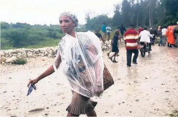  ?? AP PHOTOS ?? HURRICANE WARNINGS