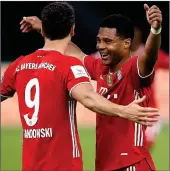  ??  ?? LETHAL PAIRING: Robert Lewandowsk­i celebrates Bayern’s third with Serge Gnabry