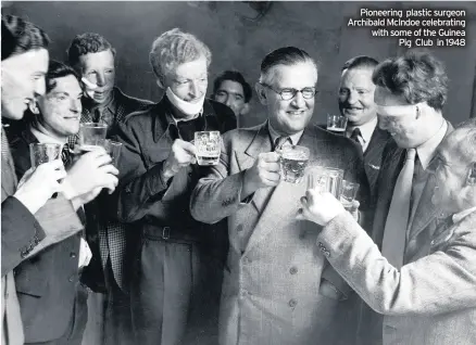  ??  ?? Pioneering plastic surgeon Archibald Mcindoe celebratin­g with some of the Guinea Pig Club in 1948