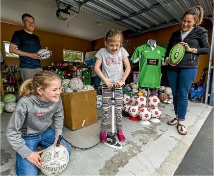  ?? PHOTO: DAVID UNWIN/STUFF ?? Andrew Mclean (back left), Lucy Mclean, 11, Millie Mclean, 8, and Denise Mclean are asking the public for unwanted sporting goods to donate to kids who don’t have access to such gear.