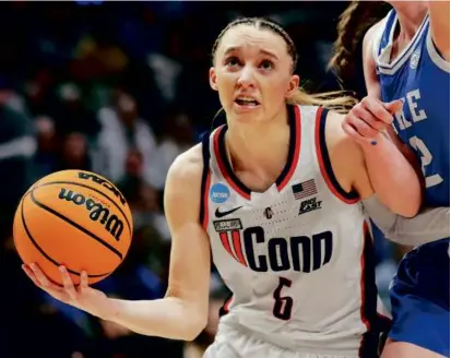  ?? STEPH CHAMBERS/GETTY IMAGES ?? UConn guard Paige Bueckers scored a game-high 24 points to power the Huskies past Duke.