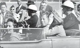  ?? James “Ike” Altgens Associated Press ?? NEWLY RELEASED documents say Soviet officials suspected President Kennedy was killed in an “ultraright” U.S. conspiracy to heighten Cold War tensions.