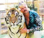  ??  ?? This undated file photo courtesy of Netflix shows Joseph “Joe Exotic” Maldonado-Passage with one of his tigers.