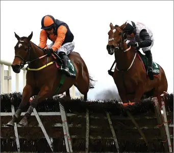  ??  ?? Seán Flanagan and Jeff Kidder jump the last on their way to victory at Fairyhouse.