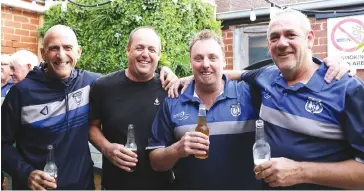  ??  ?? Celebratin­g with the side were Jason Batson, Harry Sheehan, Ken Lindsay and Paul Gavin, who enjoyed the Division 1 victory as much as the players did.