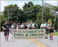  ??  ?? St. Andrew’s Pipes and Drums marches in the 25th annual Turning Point Parade.