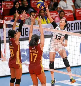  ?? —AUGUST DELA CRUZ ?? Eli Soyud of Adamson rises for a kill against the Perpetual duo of Jenny Gaviola and Jhona Rosal.