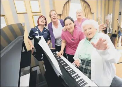  ??  ?? Sailing: Aviary Care Home resident Rose Bowd with deputy manager Maxine Phillips, manager Jenny Dawkins, and recreation organisers Beata Pekajova and Linda Mcmurray on the home’s virtual cruise