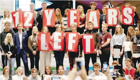  ?? — Reuters ?? Local schoolchil­dren join Greta Thunberg’s initiative on climate strike during the COP24 UN Climate Change Conference 2018 in Katowice, Poland on Friday.