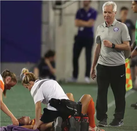  ??  ?? Dash midfielder Carli Lloyd, on the ground, suffered a right knee injury last week and will miss at least six weeks.