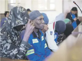  ??  ?? ACCUSED. The alleged cannibals in the dock yesterday. They face charges of murder and attempted murder in Estcourt.