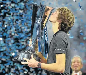  ?? Picture: GLYN KIRK/AFP ?? YOUNG GUN: Germany’s Alexander Zverev kisses the trophy after beating Serbia’s Novak Djokovic in their men’s singles final match of the ATP World Tour Finals tennis tournament at the O2 Arena in London on Sunday